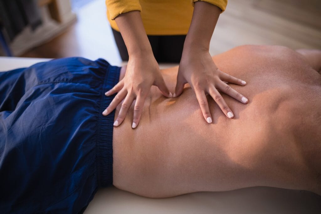 midsection of female therapist giving back massage 2025 04 03 09 36 09 utc