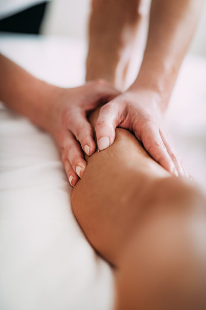 hand massaging an adult s arm on white bed 2026 01 05 06 26 19 utc